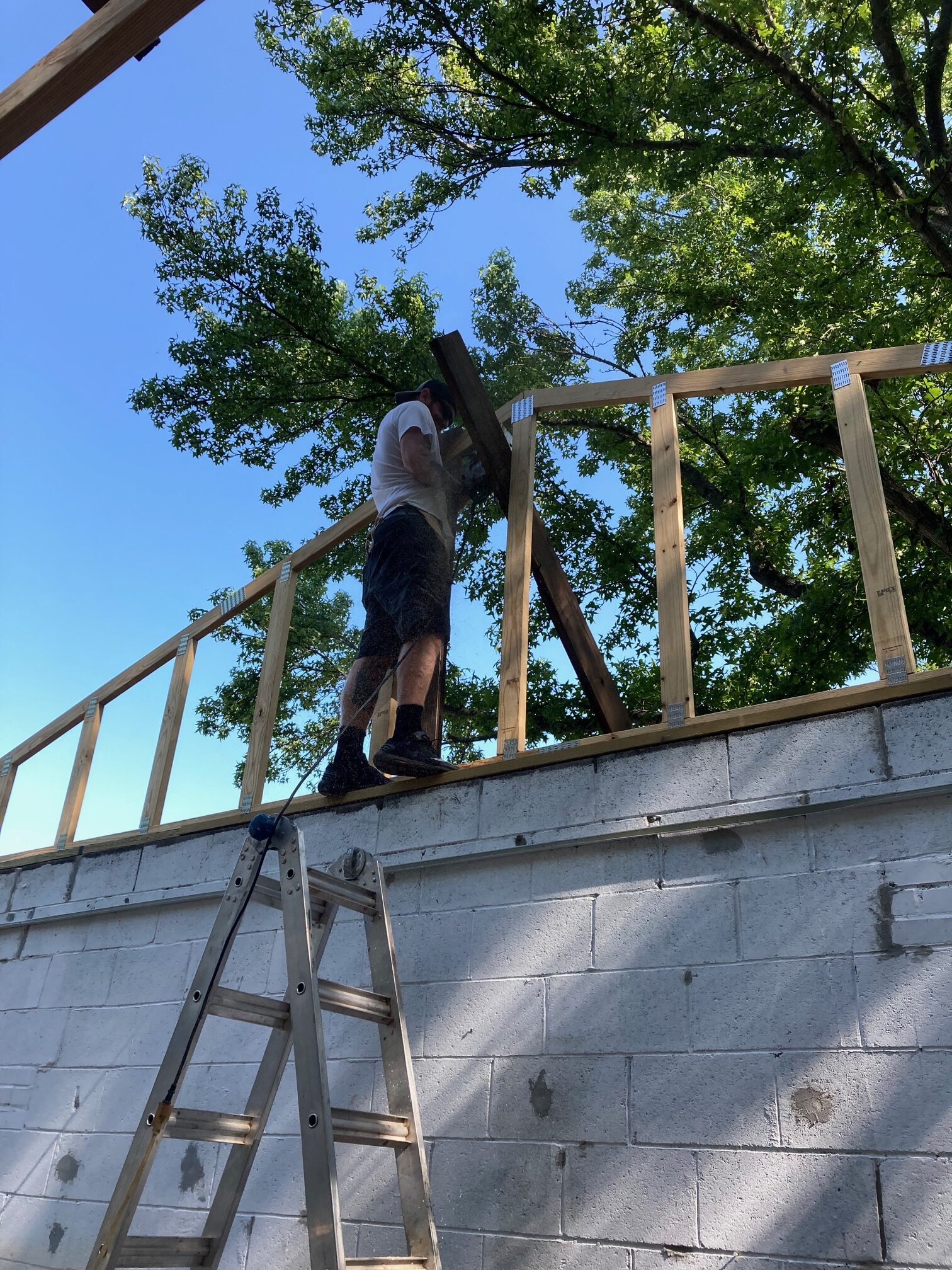 Tyler helps set Trusses