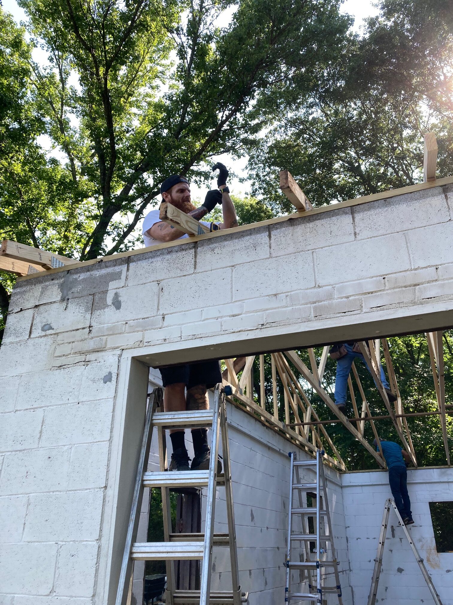 Michael helps set Trusses